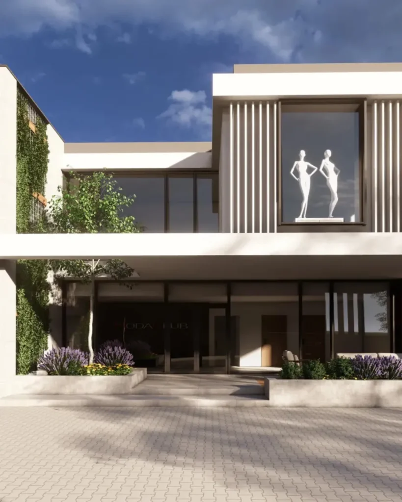 Frontowa część nowoczesnego obiektu usługowo-biurowego z elegancką strefą wejściową i minimalistyczną architekturą. Budynek wyróżnia się dużymi przeszkleniami, pionowymi lamelami oraz zieloną ścianą z roślinnością. Render architektoniczny przedstawia reprezentacyjny obiekt premium zaprojektowany z naciskiem na design, estetykę i nowoczesny charakter przestrzeni biznesowej.